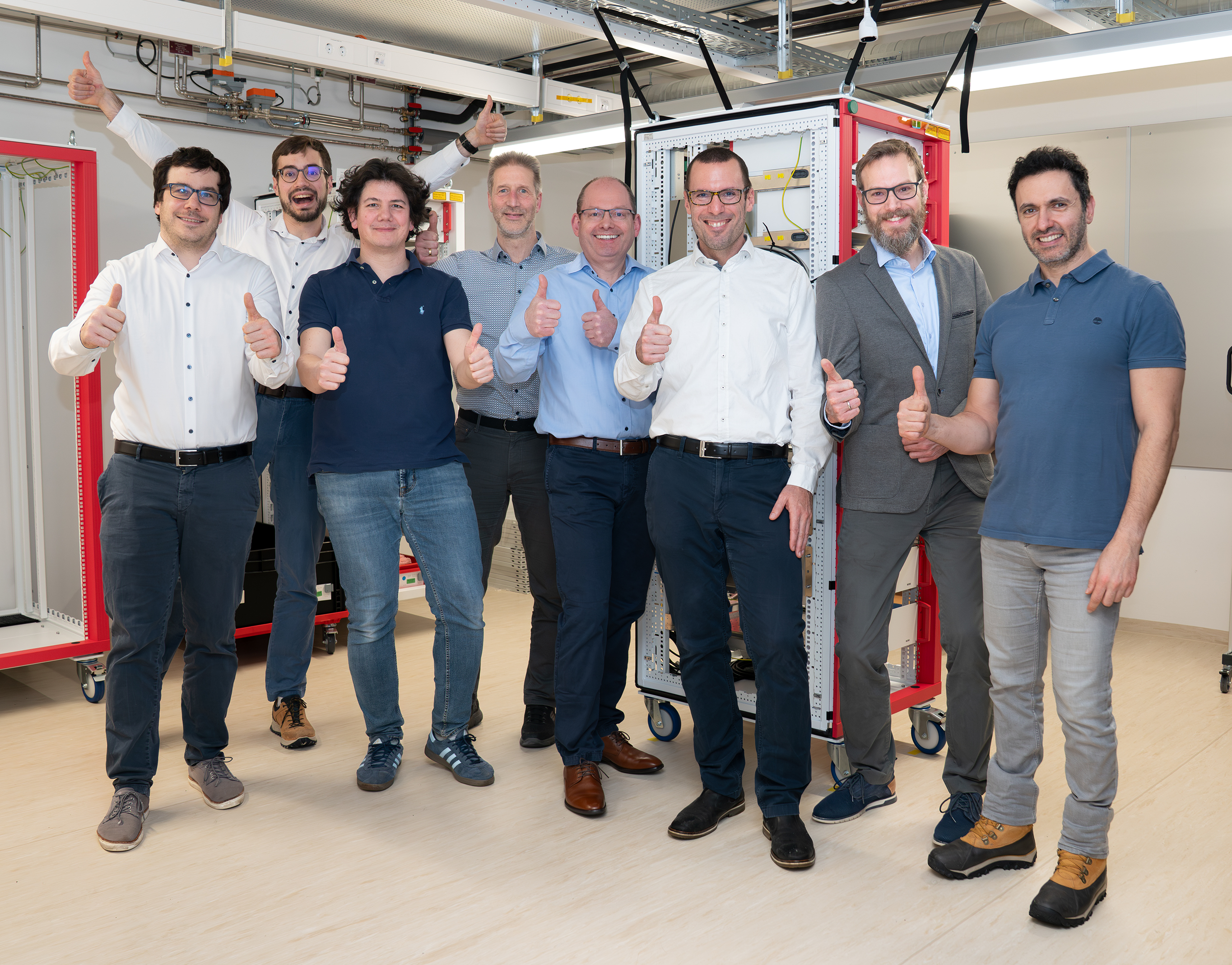 TOPTICLOCK Team, from left to right: Christoph Tresp, Dario Lago-Rivera, Pierre Thoumany, Jürgen Stuhler, Stephan Ritter, Axel Friedenauer, Daniel Heinrich, and Rami Al Kamand. Nils Huntemann (PTB) is missing in the picture.