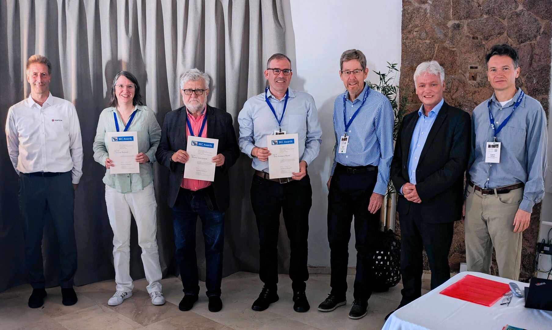 From left to right: Dr. Jürgen Stuhler (TOPTICA Photonics), Prof. Leticia Tarruell (Junior BEC Award recipient), Prof. Maciej Lewenstein (Lifetime Achievement Award recipient), Prof. Dan Stamper-Kurn (Senior BEC Award recipient), Prof. Randy Hulet (Lifetime Achievement Award recipient), Prof. Klaus Sengstock (Chair of the BEC Awards Committee), and Prof. Dr. Eugene Demler (BEC Awards Committee) – Photo by G. Astrakharchik / U. Bhattacharya 