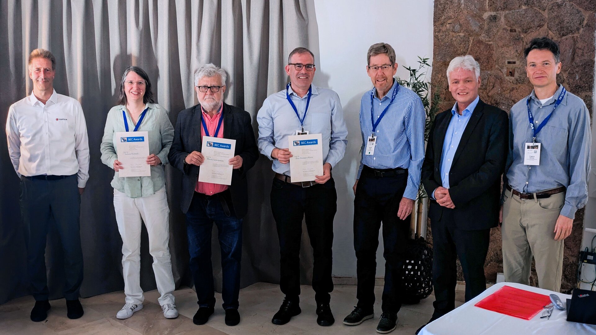 From left to right: Dr. Jürgen Stuhler (TOPTICA Photonics), Prof. Leticia Tarruell (Junior BEC Award recipient), Prof. Maciej Lewenstein (Lifetime Achievement Award recipient), Prof. Dan Stamper-Kurn (Senior BEC Award recipient), Prof. Randy Hulet (Lifetime Achievement Award recipient), Prof. Klaus Sengstock (Chair of the BEC Awards Committee), and Prof. Dr. Eugene Demler (BEC Awards Committee) – Photo by G. Astrakharchik / U. Bhattacharya 
